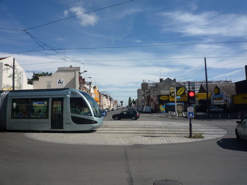 A modern tram on a city street
