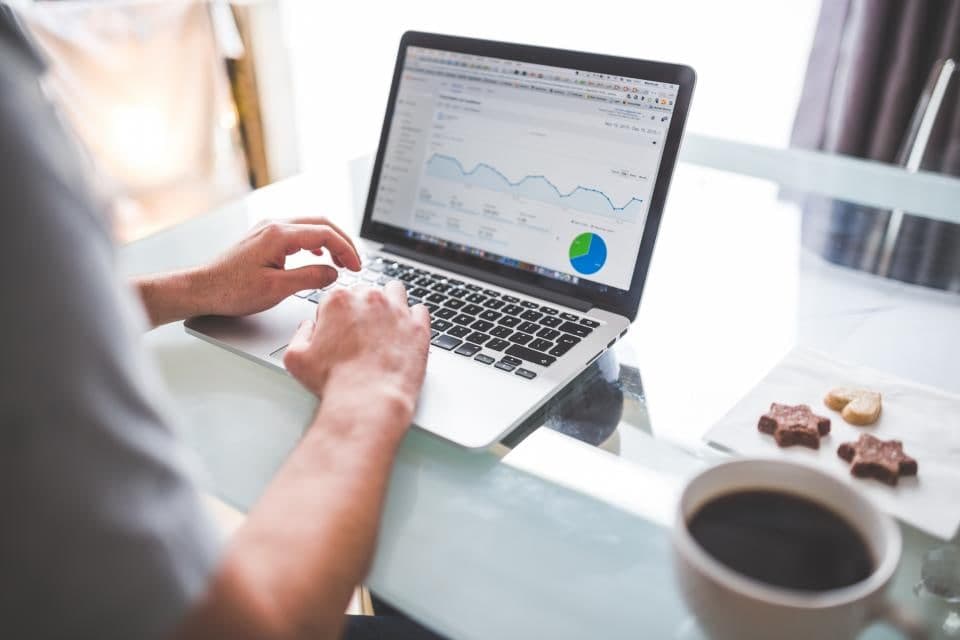 Charts and figures being read on a laptop screen