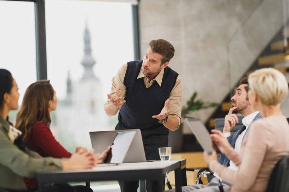 A group in discussion around a table